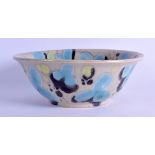 A STYLISH MID 20TH CENTURY STUDIO POTTERY BOWL with blue and green splash decoration. 20 cm
