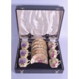 A CASED SET OF BARKER BROTHERS ROYAL TUDOR COFFEE CUPS AND SAUCER with EPNS spoons.