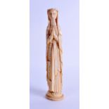 A 19TH CENTURY AFRICAN CARVED IVORY FIGURE OF THE VIRGIN MARY modelled upon an oval plinth. 25 cm
