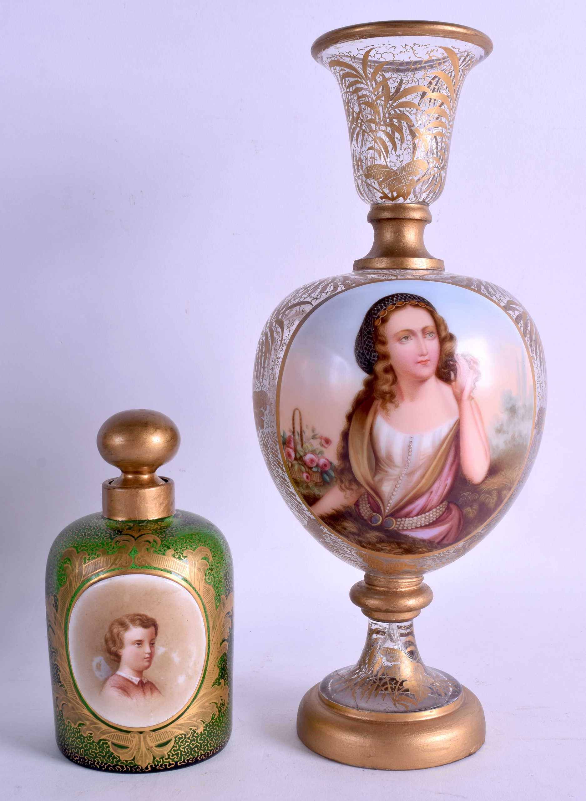 A 19TH CENTURY BOHEMIAN CLEAR GLASS VASE painted with gilt foliage and a portrait of a pretty