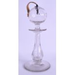 AN UNUSUAL 19TH CENTURY GLASS CANDLESTICK/LANTERN with circular central sconce. 25.5 cm high.