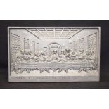 AFTER LEONARDO DA VINCI (1452-1519), a cast metal plaque, depicting the last supper. 34 cm wide.