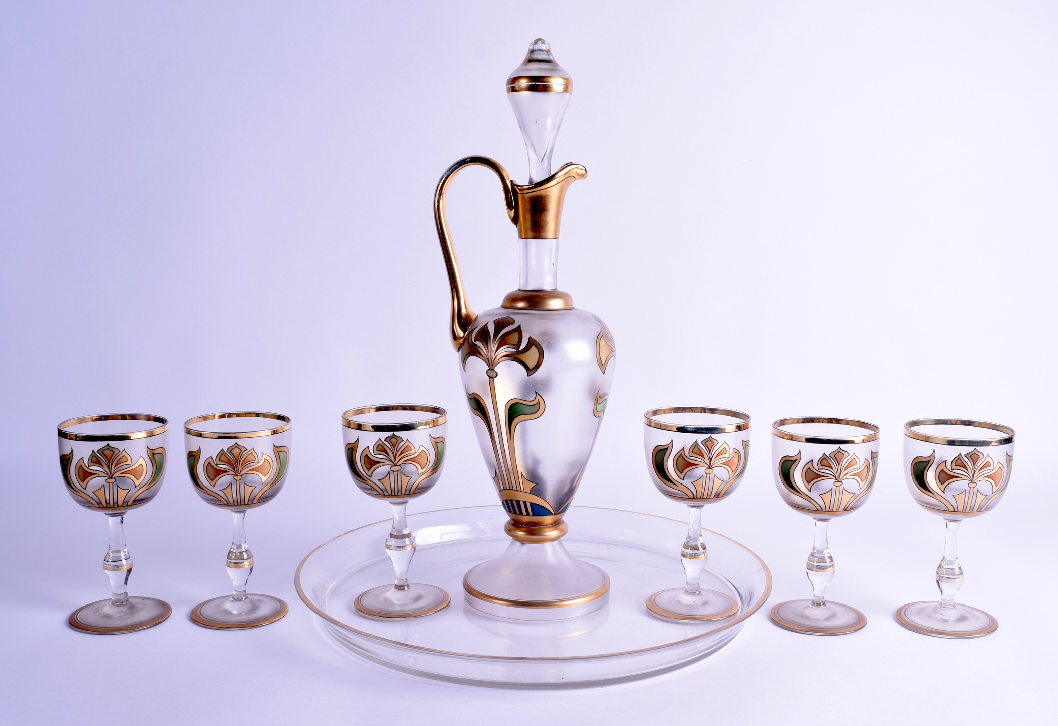 AN AUSTRIAN SECESSIONIST ART NOUVEAU GLASS DECANTER with six matching glasses and tray, overlaid