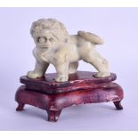 AN EARLY 20TH CENTURY CHINESE CARVED SOAPSTONE DOG OF FOE modelled roaming upon all fours. 7 cm