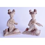 A PAIR OF CHINESE TANG DYNASTY POTTERY FIGURES OF FEMALES modelled upon square form bases. 13 cm x