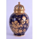 A LATE 19TH CENTURY LIMOGES PORCELAIN VASE AND COVER painted in raised gilt foliage and vines. 21.