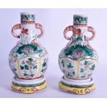 A RARE PAIR OF EARLY 18TH CENTURY CHINESE FAMILLE VERTE VASES ON STANDS Kangxi, painted with flowers