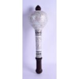 A RARE INDIAN CEREMONIAL CARVED HARDWOOD AND MOTHER OF PEARL MACE decorated with various motifs.