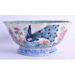 A 19TH CENTURY CHINESE FAMILLE ROSE LOBED BOWL Tongzhi mark and period, painted with a peacock