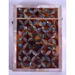 A VICTORIAN MOTHER OF PEARL AND TORTOISESHELL CARD CASE decorated with floral shaped abalone shell