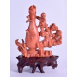 A GOOD 19TH CENTURY CHINESE CARVED RED CORAL SNUFF BOTTLE AND STOPPER of figural form, modelled as a