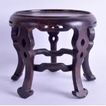 A LATE 19TH CENTURY CHINESE CARVED HARDWOOD STAND of circular form upon five scrolling legs. 17 cm x