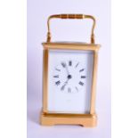 AN EARLY 20TH CENTURY FRENCH BRASS MARGAINE CARRIAGE CLOCK signed Murray Paris, with black numerals.