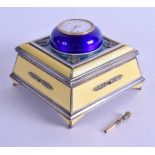 A RARE RUSSIAN SILVER AND ENAMEL SQUARE FORM TABLE CLOCK the rising top inset with a circular gilt