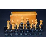 AN ANTIQUE BOXED CHESS SET, of plain form. King height 8.2 cm.