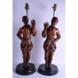 A LARGE PAIR OF 19TH CENTURY CARVED WOODEN FIGURES OF BLACKAMOORS converted to lamps, modelled