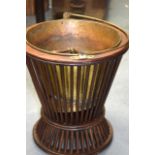 AN ANTIQUE REEDED WOODEN BUCKET, with brass liner & swing handle. 34 cm high.