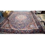 A LARGE 19TH CENTURY BLUE GROUND TABRIZ AREA RUG, decorated with flowers and foliage. 390 cm x 290