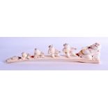 A LOVELY 19TH JAPANESE MEIJI PERIOD CARVED IVORY OKIMONO depicting four young boys pulling at a