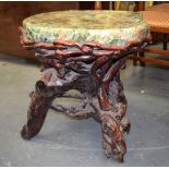 AN UNUSUAL LARGE CHINESE FLUORITE TOP TABLE, supported on naturalistic wooden base. 50 cm x 59 cm.