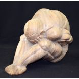 A LARGE CARVED WOODEN SCULPTURE, formed as a male with his head in his hands. 30 cm x 35 cm.