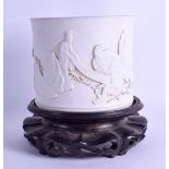A CHINESE UNGLAZED BLANC DE CHINE BRUSH POT bearing Qianlong marks to base, decorated with