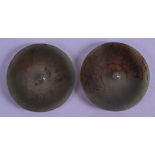 A PAIR OF CHINESE MUTTON JADE CIRCULAR TOGGLE engraved with motifs. 5.25 cm diameter.