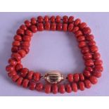 AN 18CT GOLD MOUNTED CARVED RED CORAL NECKLACE. 41 grams. 42 cm long. Each bead 0.25 cm wide.