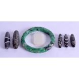 A GROUP OF FIVE CHINESE CARVED AGATE ZHU BEADS together with a larger arm bangle & a small jade