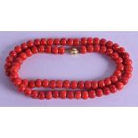 AN 18CT GOLD MOUNTED CARVED RED CORAL NECKLACE. 48 grams. 48 cm long. Each bead 0.25 cm wide.