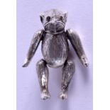 A SILVER BEAR PIN CUSHION.