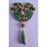 A VERY UNUSUAL ART DECO GREEN BAKELITE IVORY AND CARVED NUT NECKLACE. 112 cm long.