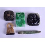 A CHINESE CARVED MUTTON JADE BUCKLE together with a jadeite seal, a mutton jade seal and two others.