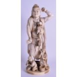 A FINE 19TH CENTURY JAPANESE MEIJI PERIOD CARVED IVORY OKIMONO modelled as a buddhistic male wearing