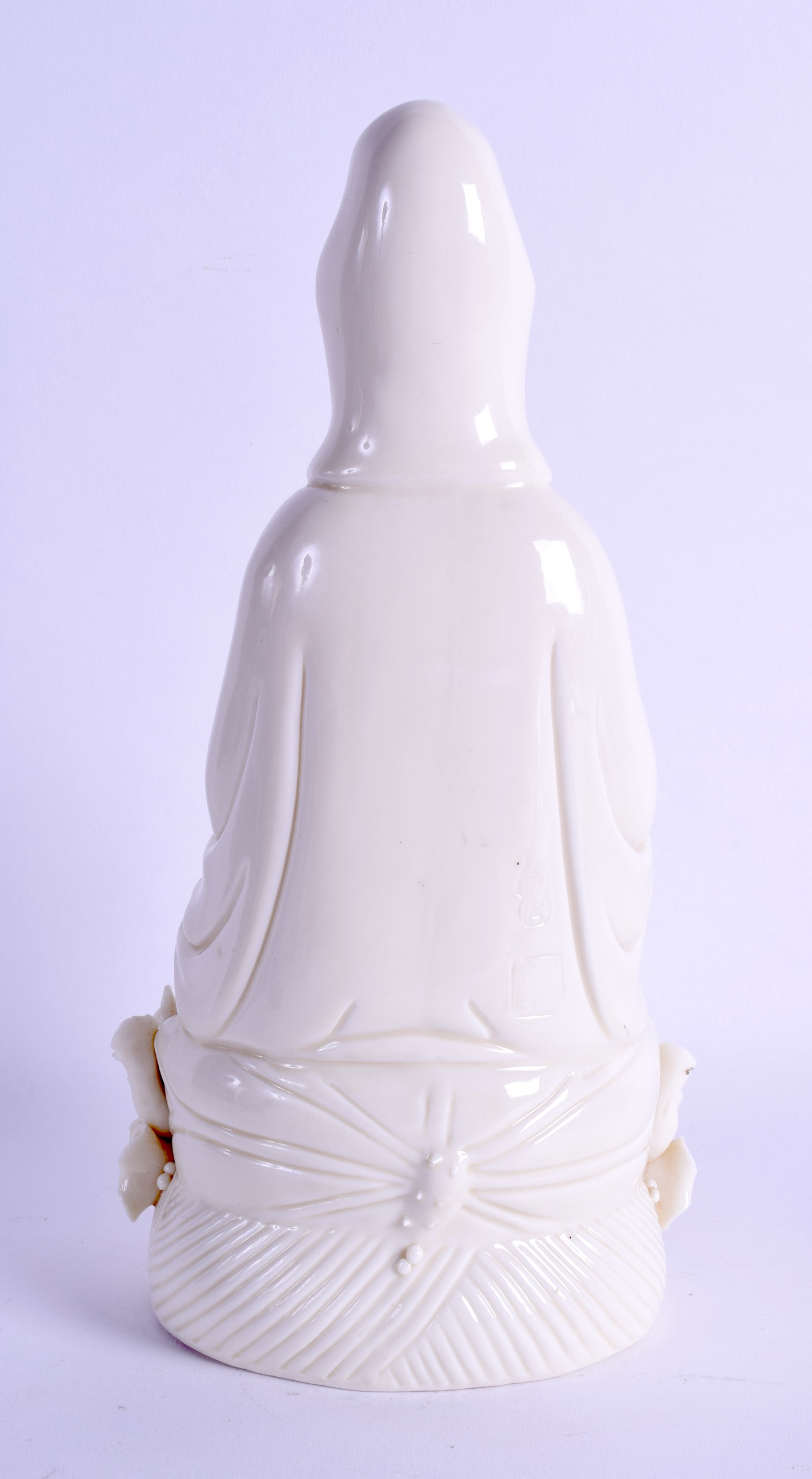 A CHINESE BLANC DE CHINE FIGURE OF GUANYIN modelled holding a vessel upon a lotus base. 27 cm high. - Image 2 of 4