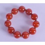 A CHINESE CARVED RED CARNELIAN AGATE BRACELET. 18 cm long overall.