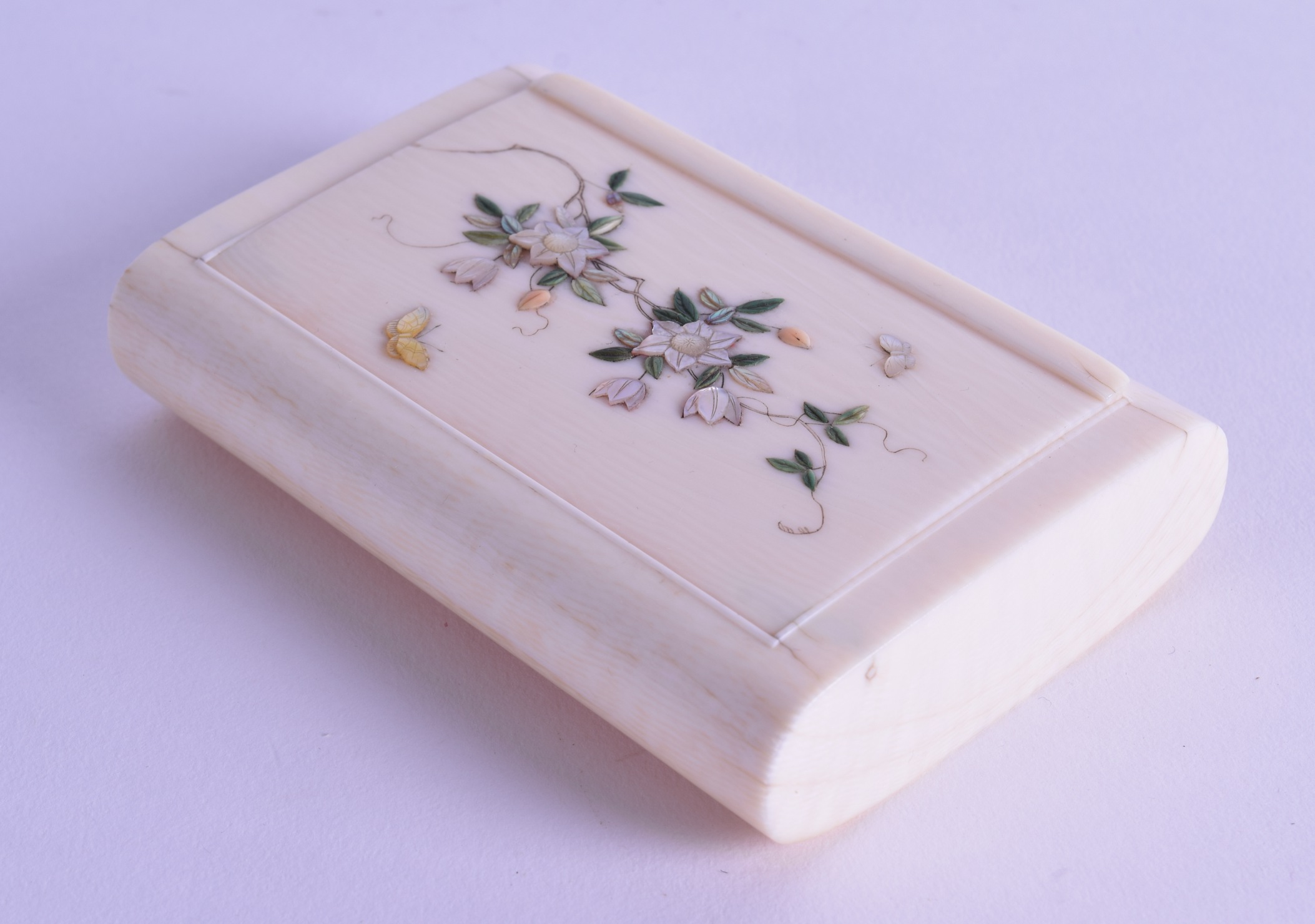 A LATE 19TH CENTURY JAPANESE MEIJI PERIOD CARVED IVORY BOX AND COVER shibayama inlaid with floral