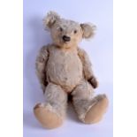 A 1950S ENGLISH TEDDY BEAR. 58 cm long.