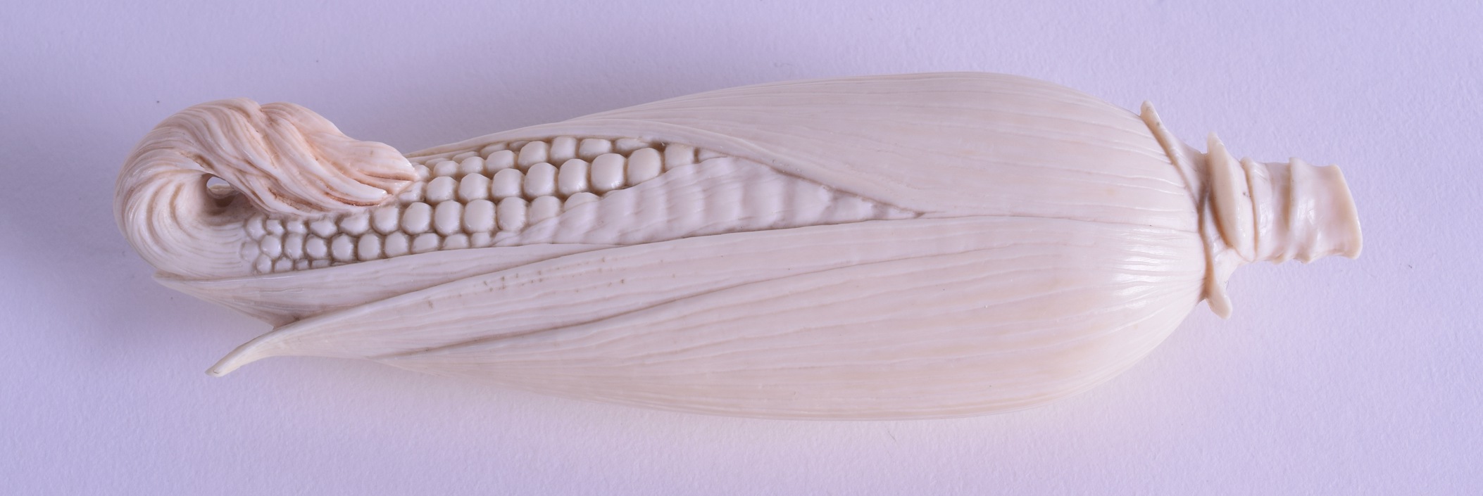 A GOOD 19TH CENTURY JAPANESE MEIJI PERIOD CARVED IVORY CORN ON THE COB of naturalistic form. 14 cm