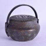 A 19TH CENTURY CHINESE BRASS HAND WARMER AND COVER with openwork floral top. 15 cm wide.