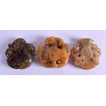 THREE CHINESE CARVED HARDSTONE AMULETS. Largest 5.75 cm wide. (3)