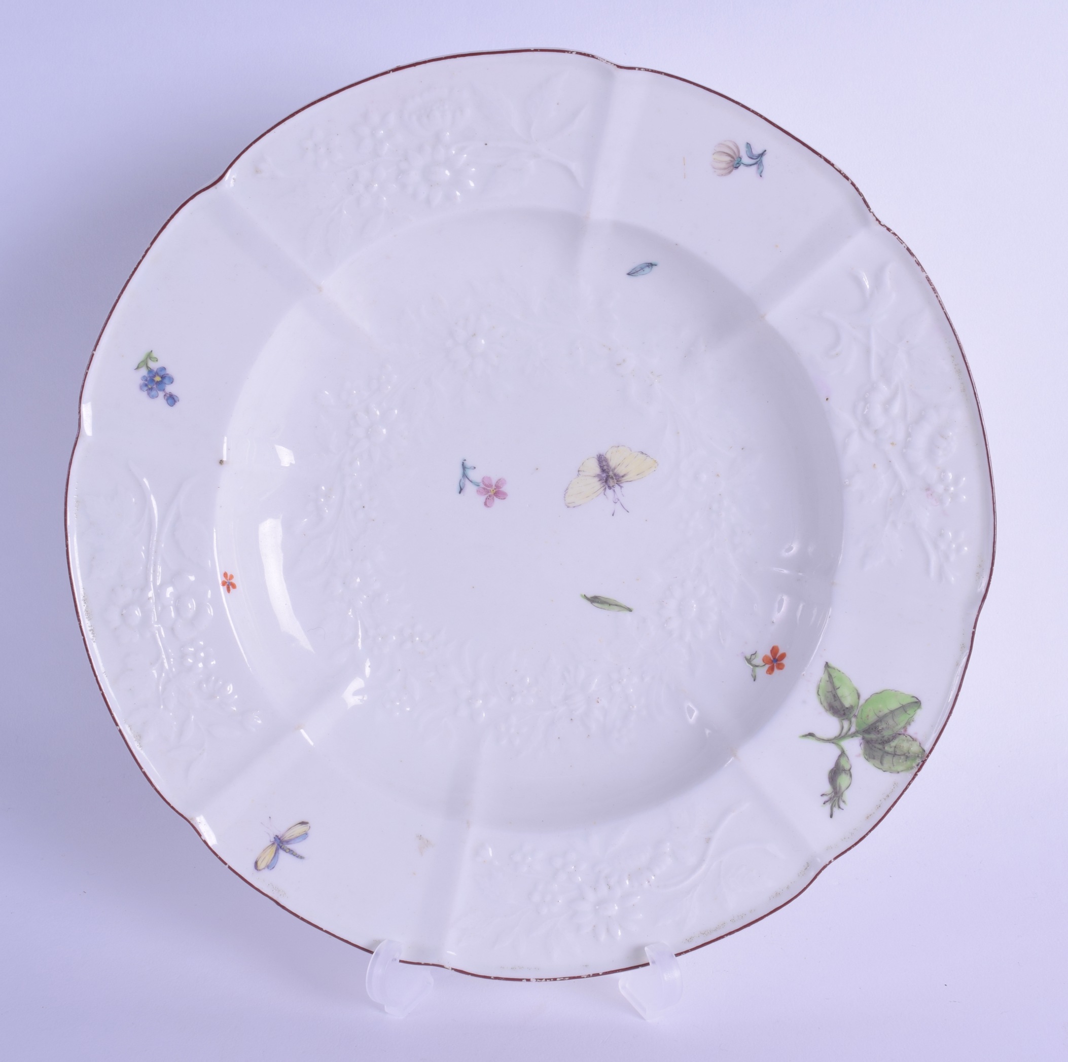 18th c. Chelsea plate finely moulded with flowers and painted with flower sprigs and insects,