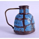 AN UNUSUAL PERSIAN ENAMELLED COPPER JUG decorated with Kufic like script. 6.5 cm high.