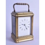 A 19TH CENTURY FRENCH BRASS CARRIAGE CLOCK with white enamel dial and black painted numerals. 18.5