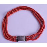 A SILVER MOUNTED CARVED RED CORAL NECKLACE. 74 grams. 42 cm long.