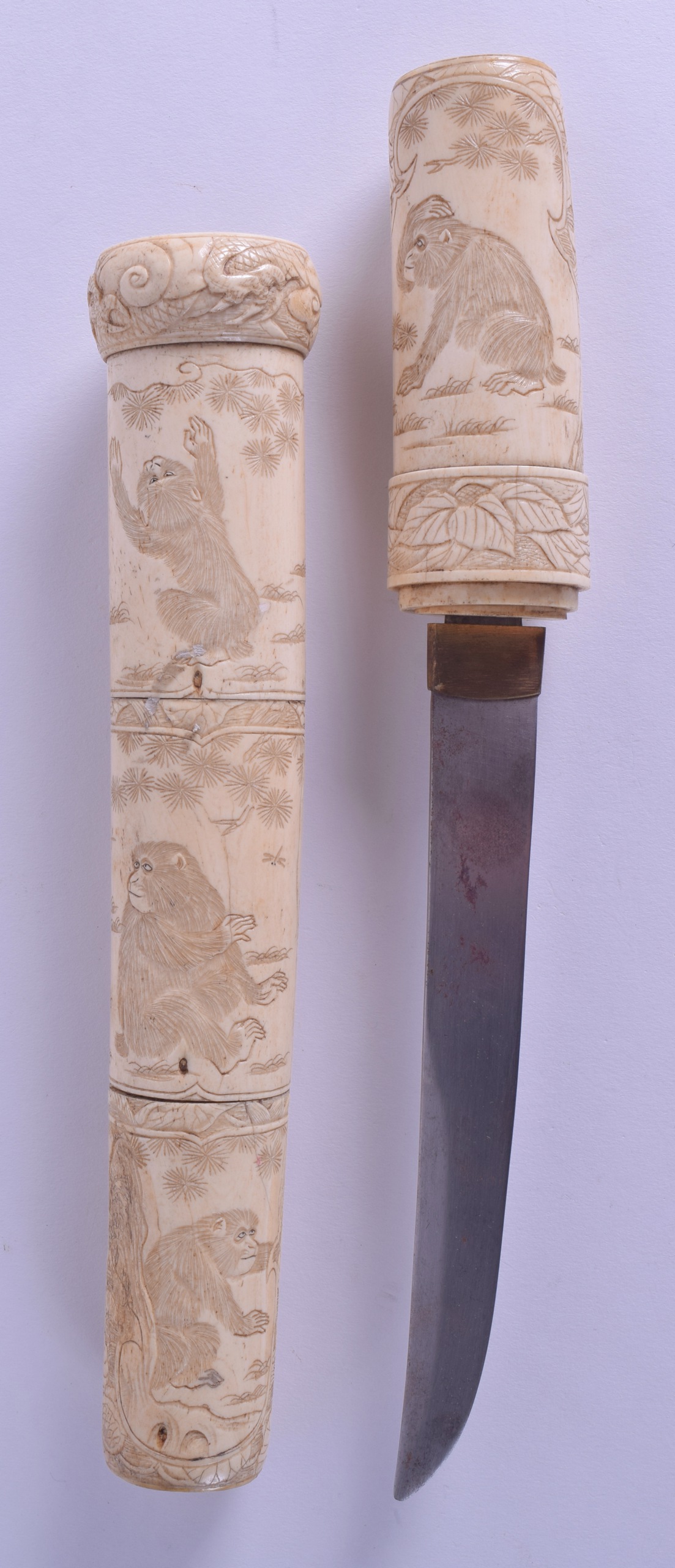 A 19TH JAPANESE MEIJI PERIOD CARVED IVORY TANTO DAGGER unusually carved with monkeys within - Image 2 of 2