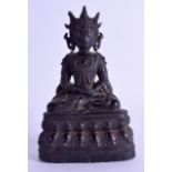 A 17TH CENTURY CHINESE BRONZE FIGURE OF A SEATED BUDDHA Ming, modelled upon a triangular lotus