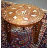 AN INDIAN HARDWOOD OCCASIONAL TABLE, inlaid decoration depicting elephants in panels.35 cm high.