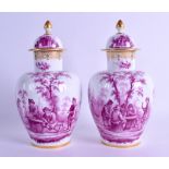 A FINE PAIR OF 19TH CENTURY MEISSEN PORCELAIN VASES AND COVERS decorated in puce with figures within