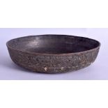 AN EARLY PERSIAN OR ARABIC CIRCULAR MIXED METAL BOWL decorated with extensive motifs and foliage. 18